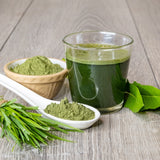 green drink in a glass and ingredients