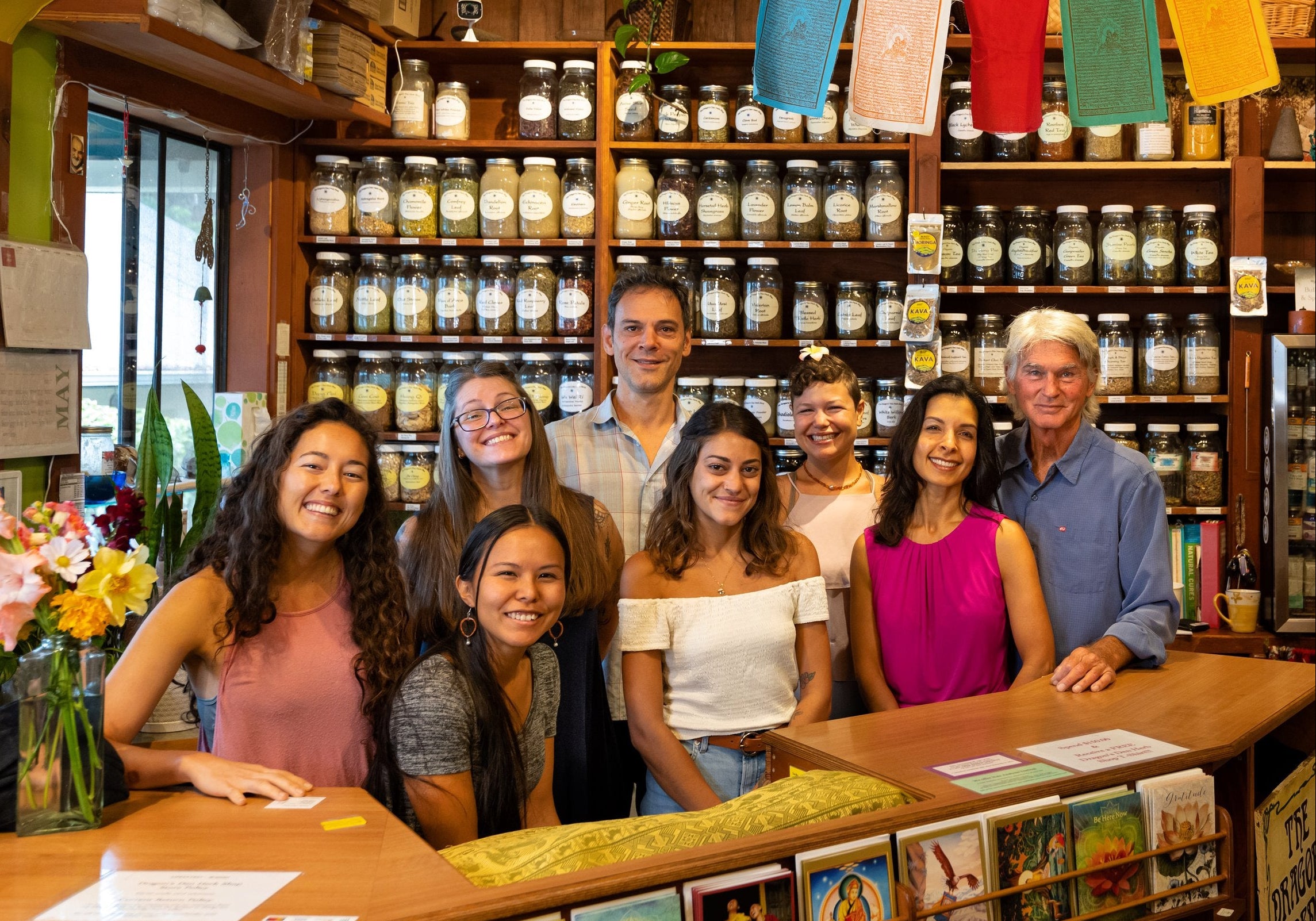 the dragons den staff behind the counter at the store